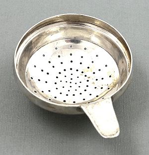 Archibald Knox Cymric sterling tea strainer for Liberty & Co.
